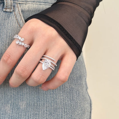 Close-up of a hand wearing a 2.75ct pear cut diamond ring 925 silver