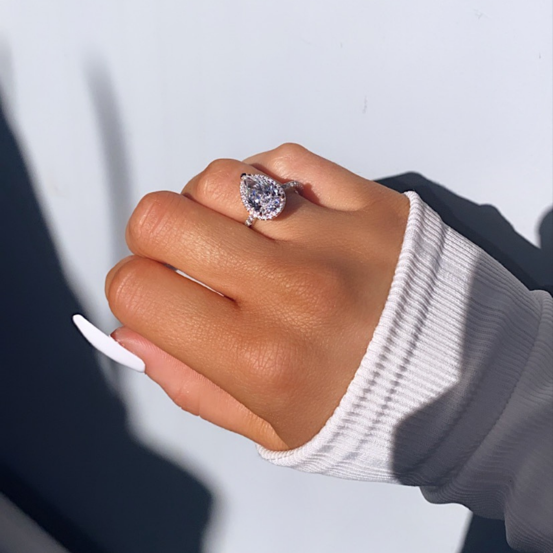 Elegant Pear-Shaped Diamond Engagement Ring 18k white gold on a hand model